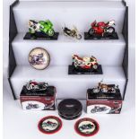 A collection of diecast model motor bikes and coasters