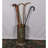 A brass stick stand and walking canes