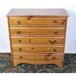 A pine chest of five drawers