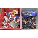 A box of Lego and a box containing Britain's model cowboys and other figures