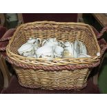 A basket containing Japanese eggshell tea ware