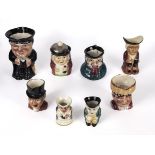 Eight small character jugs