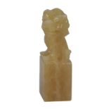 Orange calcite carving of fo dog