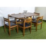 A retro dining table and six dining chairs