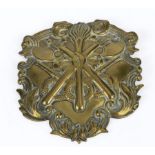 Fireman's antique brass helmet badge with two crossed fire axes and a flaming torch size 4" x 3"