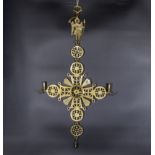 A large brass articulated Greek Orthodox candle sconce, 70cm