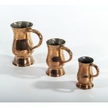 Three graduated Victorian copper measures, half pint, gill and half gill