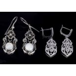 A pair of silver dropper earrings set with pearls and a pair of marcasite silver earrings