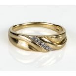 A gents 9ct gold ring set with three diamonds, UK size W