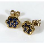 A pair of 9ct gold earrings set with sapphires