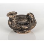 Ancient Greek Attica blackware oil lamp, the centre roundel moulded in relief with the head of