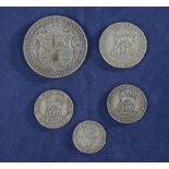 A silver half crown, shilling, two sixpence pieces and a threepence piece all 1921