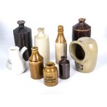 A collection of stoneware bottles, salt pig and an inhaler