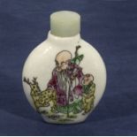 A Chinese snuff bottle decorated to one side with a sage and a poem to reverse