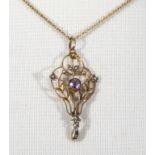A 9ct gold chain and pendant set with amethysts and seed pearls