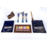 Two cased sets of drawing instruments, a miniature plane and other items