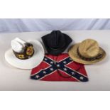 Two Stetsons, a straw hat and a small USA confederate flag