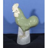 Chinese celadon glazed figure of a cockerel standing on a rocky base circa 1920/30s height 12"