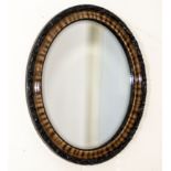 A mahogany oval mirror 60cm x 50cm