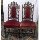 A pair of carved and upholstered dining/hall chairs (one chair in need of repair)