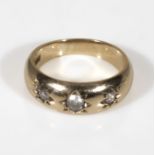A 9ct gold ring set with three diamonds. UK size J
