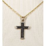 A 9ct gold chain with a cross set with black diamonds