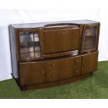 A retro oak sideboard with cocktail cabinet