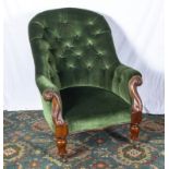 A Victorian mahogany button back arm chair of pleasing shape.
