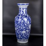 A large blue and white Chinese style pottery vase, 60cm tall
