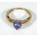 A 9ct gold ring set with a blue stone, UK size J