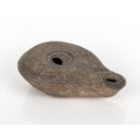 Ancient Middle-Eastern hand held terracotta oil lamp of small size probably Canaanite/Sumarian
