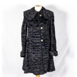 A ladys faux fur coat, size UK 10
