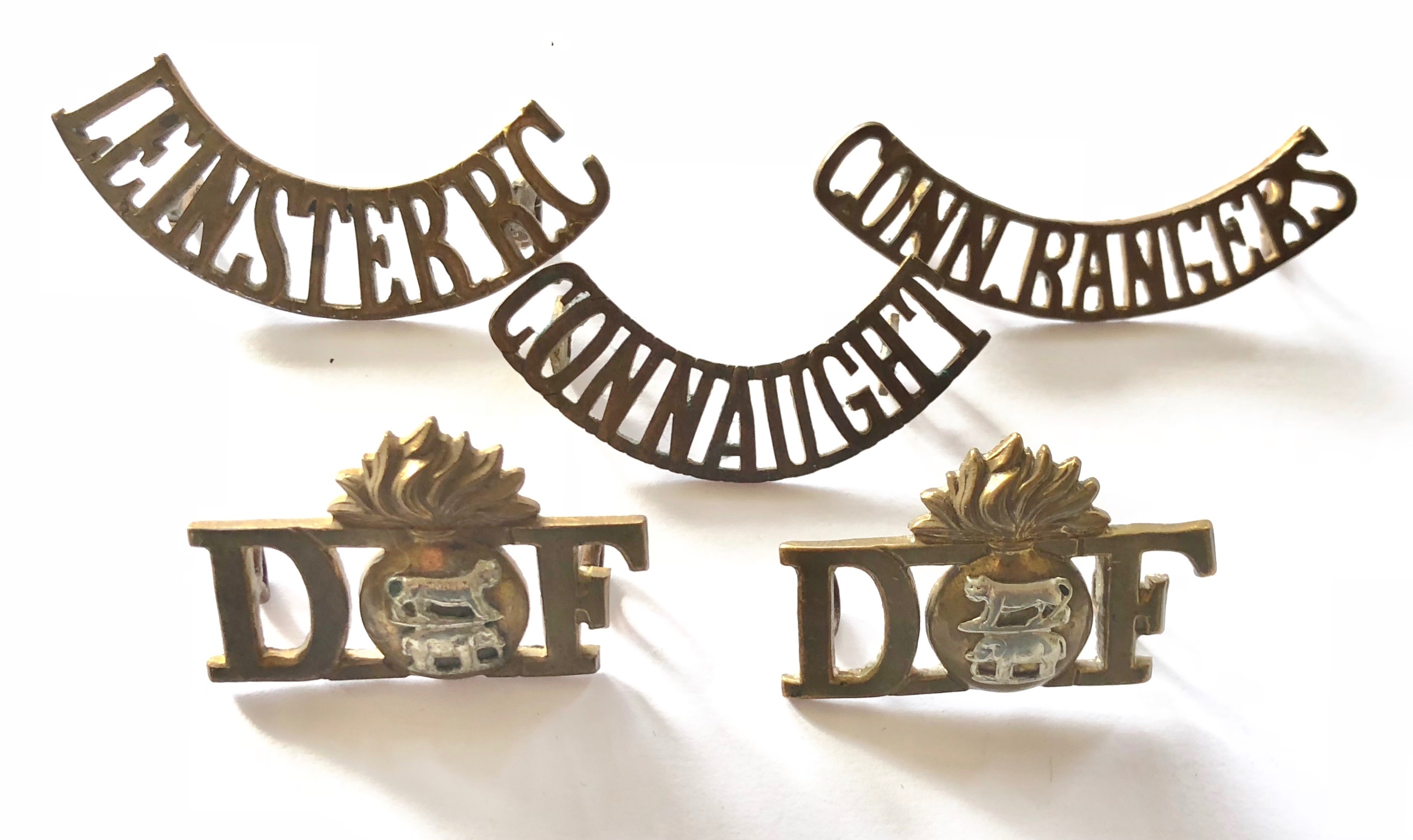 5 Irish pre 1922 brass shoulder titles.LEINSTER R.C ... CONNAUGHT ... CONN.RANGERS ... 2 x facing