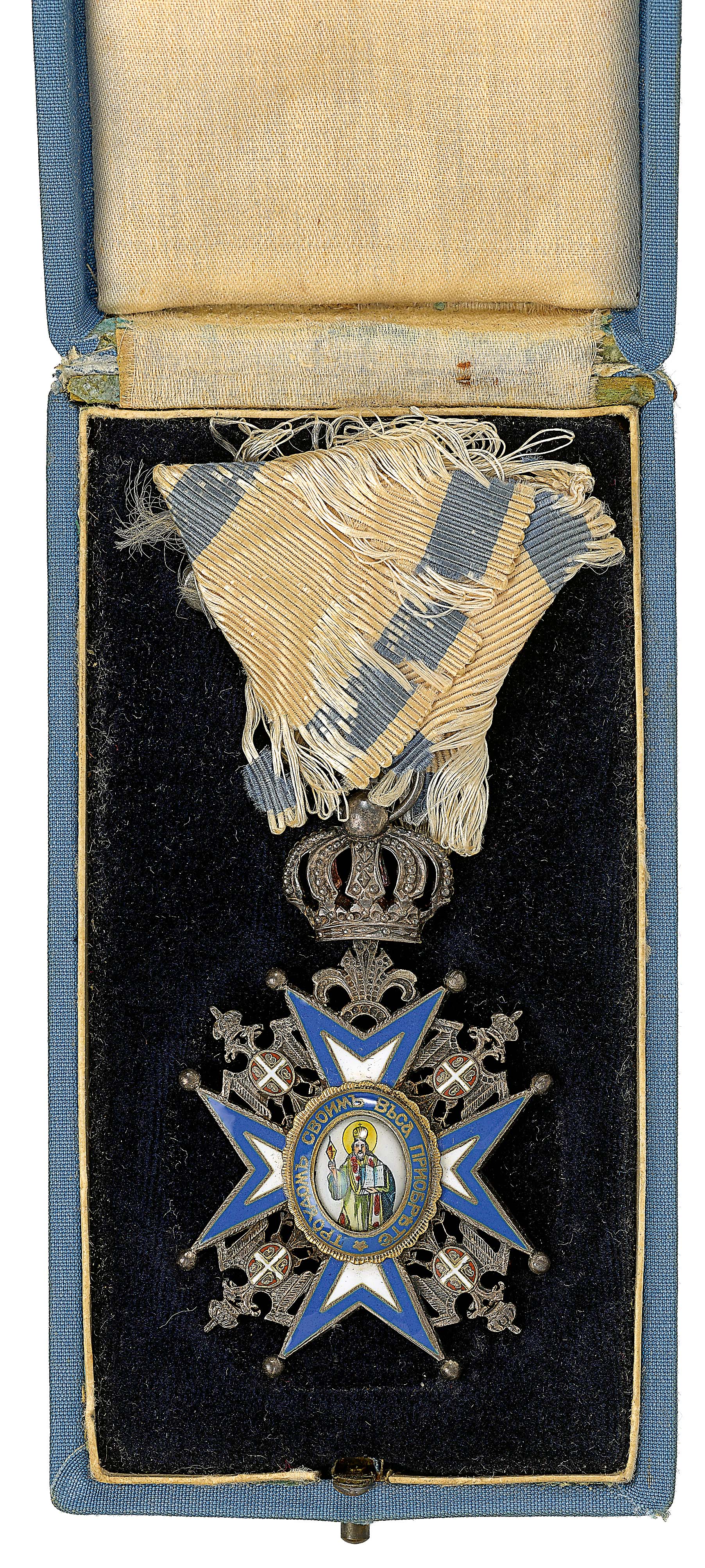 Serbia. Order of the St. Sava 5th Class, cased breast badge.A fine example in silver-gilt and