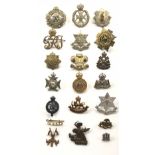 17 assorted Colonial cap badges, a collar and title.