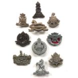 10 WW2 plastic economy cap badges.