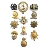 12 assorted cap badges.