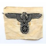 German Third Reich. SS silver wire eagle and swastika from car pennant.