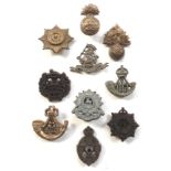 10 WW2 plastic economy cap badges.