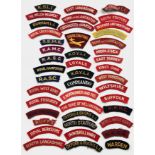 44 assorted cloth shoulder titles.