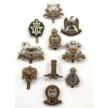 10 Cavalry cap badges.