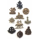 10 WW2 plastic economy cap badges.