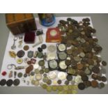 A Victorian silver crown 1887 and other silver coins, together with tokens, mixed world wide