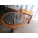 Mid 20th century teak furniture consisting of a nest of tables, a glass topped Astro coffee table