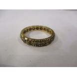A 9ct gold and sapphire set eternity ring