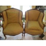 A pair of reproduction French style armchairs, floral crest rails, scrolled arms, cabriole front