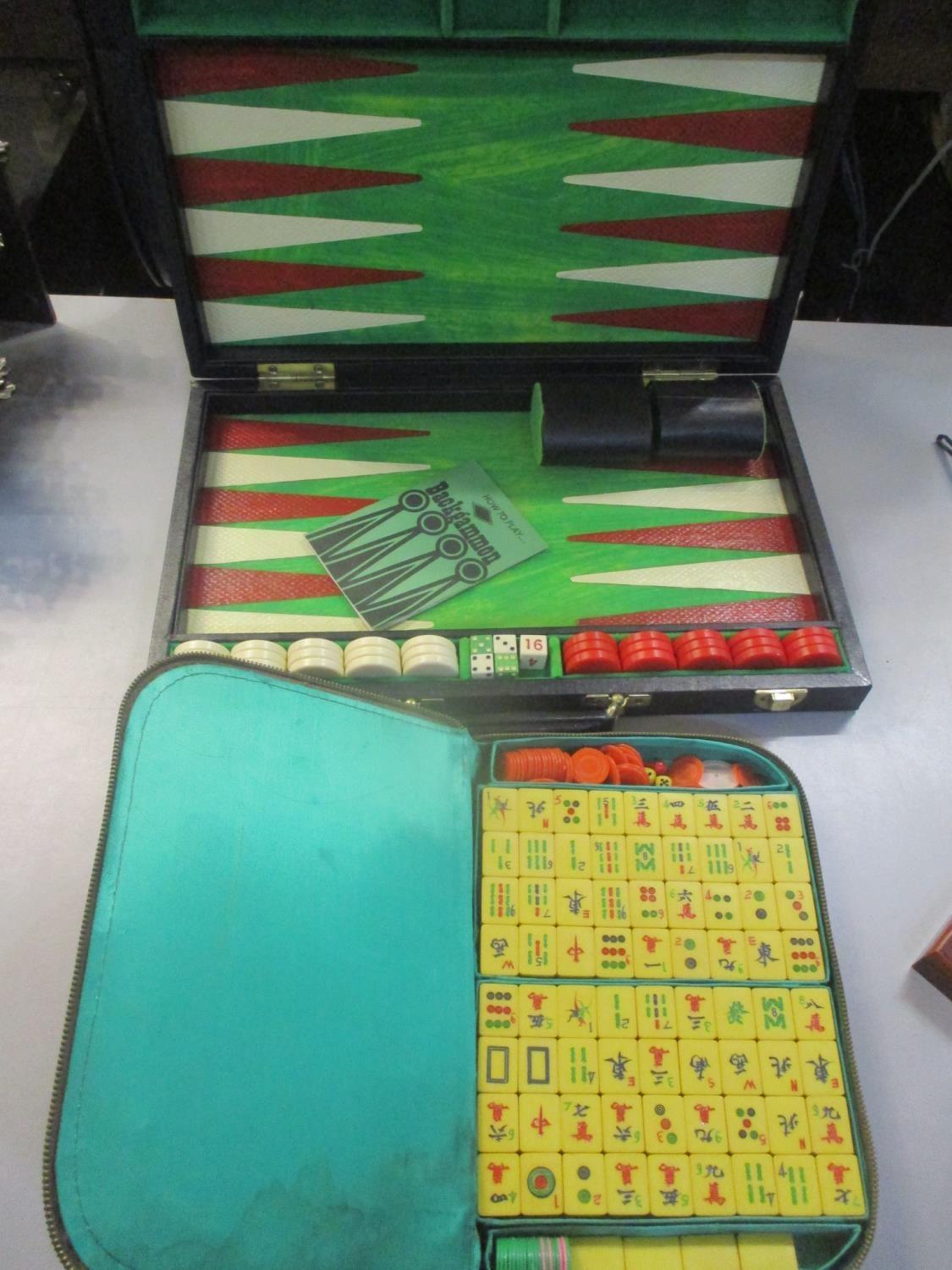 A cased Mah Jong set, together with a Backgammon set