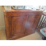 A French style oak and marble topped side cabinet with fielded, arched, panelled doors fitted with a