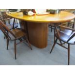 A Skovby (Denmark) cherry wood extending dining table with rising leaf on pedestal base circa 1980