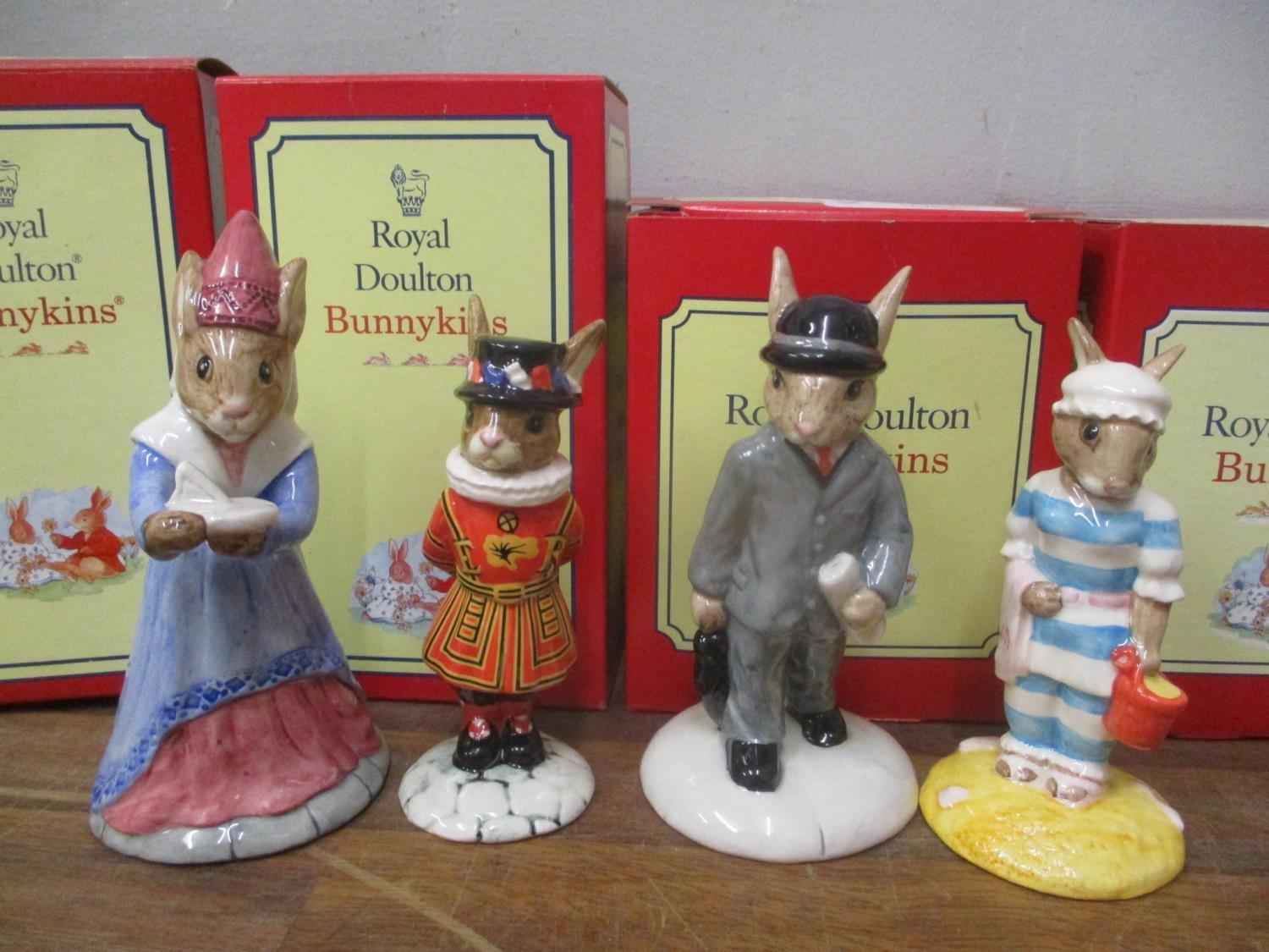 Four boxed Royal Doulton Bunnykins ornaments to include Sundial, Beefeater, Businessman and Mother